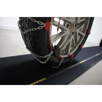 Tapis de protection pour véhicules équipés de chaînes à neige